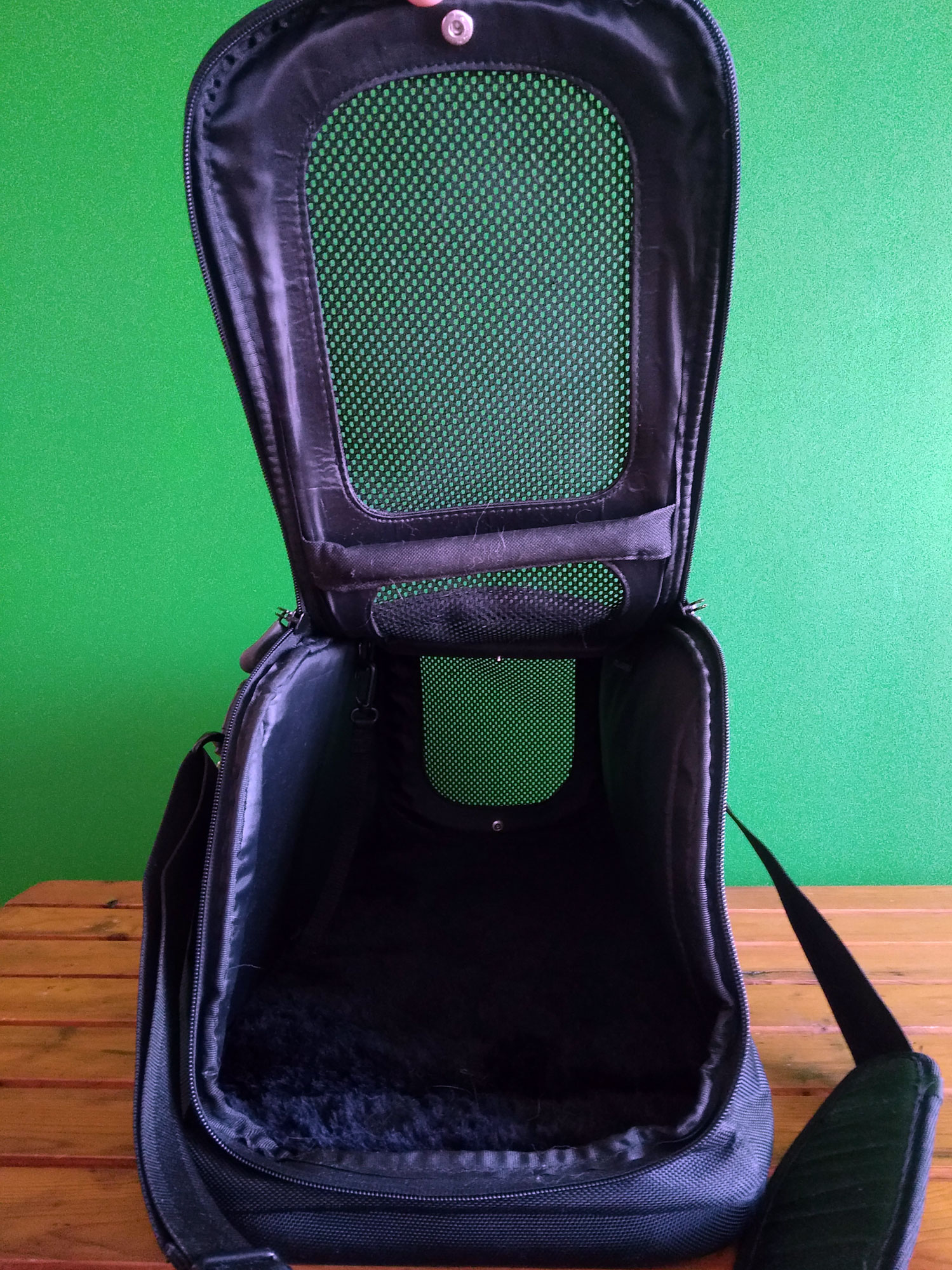 My black cat carrier with a sturdy strap and a big mesh window - perfect for flying.