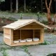 Outdoor cedar cat feeding station with extended roof