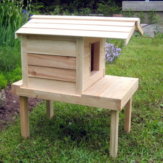 Cat house on platform with extended roof - side view